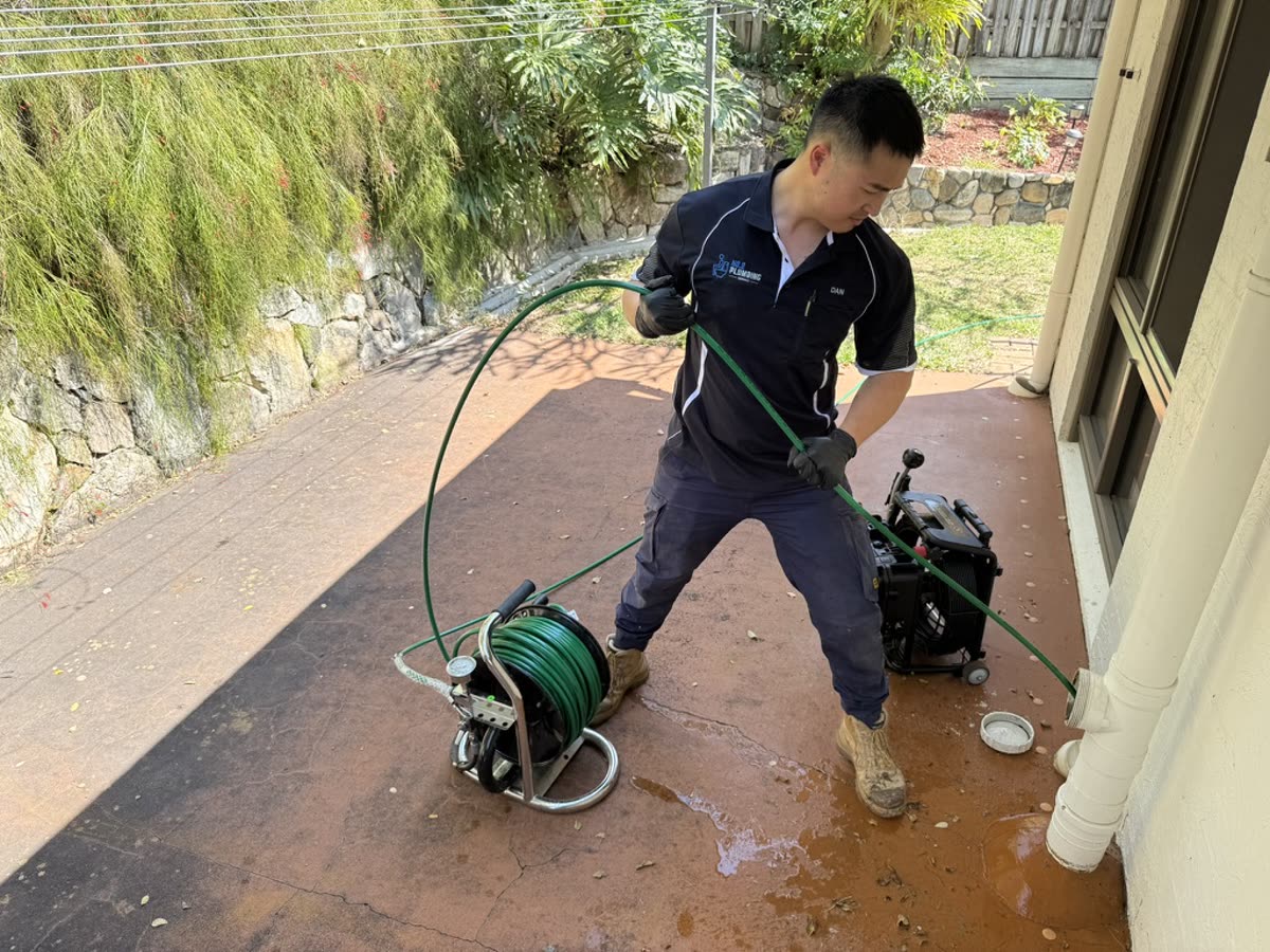Daniel jetting a blocked drain at a Brisbane home
